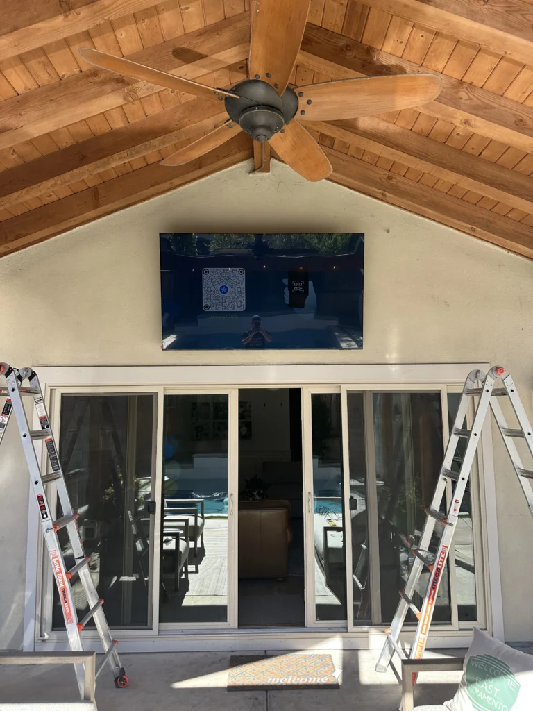 TV mounted high on a vaulted wall